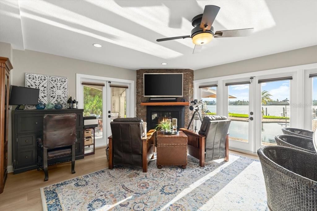 Fireplace, Interior, Living room, Recessed Lighting, Water, Wood Texture Flooring