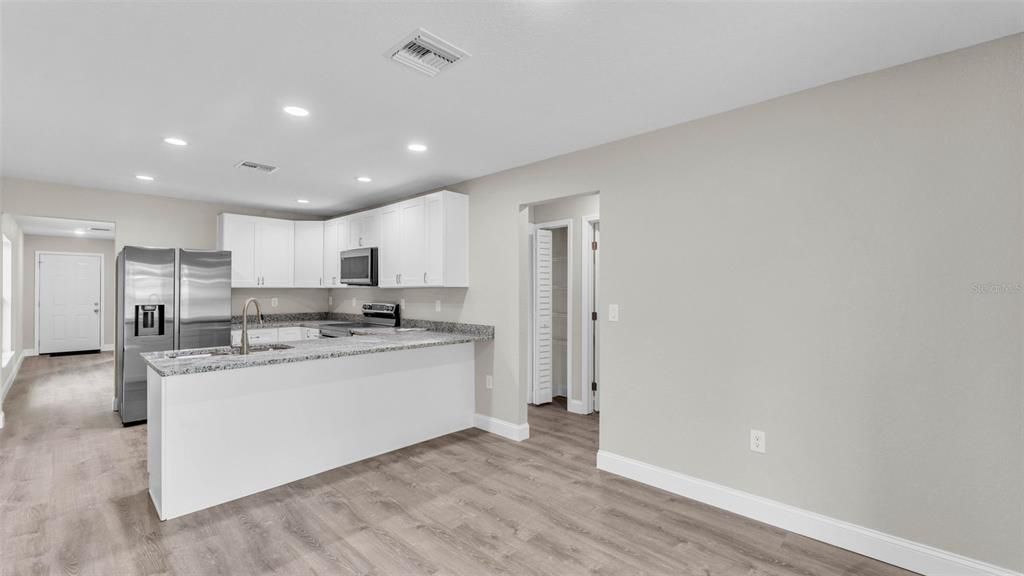 Interior, Kitchen, Recessed Lighting, Stainless Steel Appliances, Wood Texture Flooring