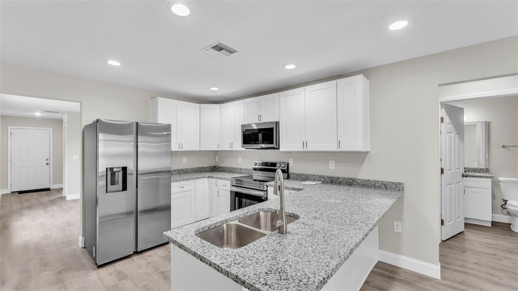 Interior, Kitchen, Recessed Lighting, Stainless Steel Appliances, Wood Texture Flooring