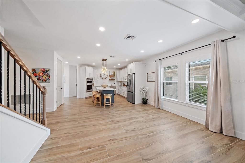 Chandelier, Dining room, Interior, Kitchen, Pendant Lights, Recessed Lighting, Stainless Steel Appliances, Wood Texture Flooring