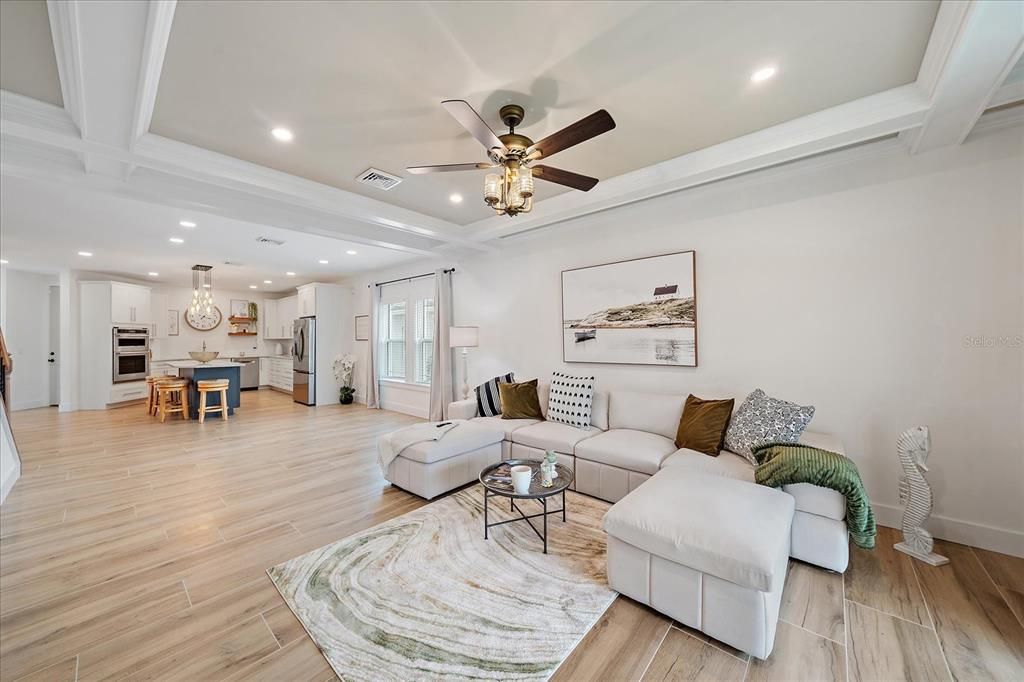 Chandelier, Interior, Kitchen, Living room, Recessed Lighting, Stainless Steel Appliances, Wood Texture Flooring