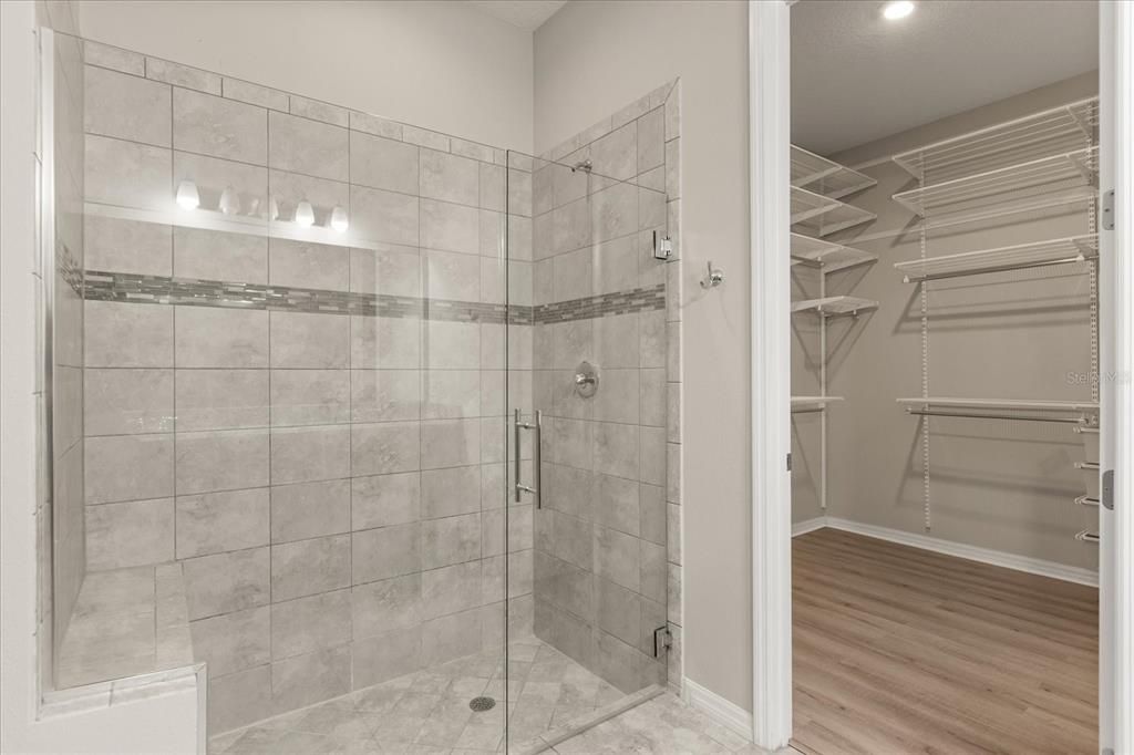 Bathroom, Glass Shower, Interior, Recessed Lighting, Walk-in Closets, Wood Texture Flooring