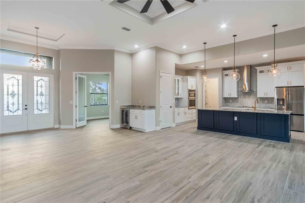 Empty room, Interior, Kitchen, Pendant Lights, Recessed Lighting, Stainless Steel Appliances, Wood Texture Flooring