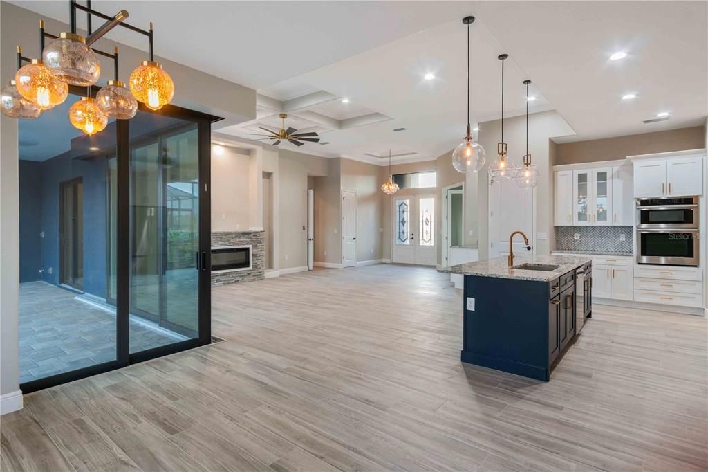 Fireplace, Interior, Kitchen, Pendant Lights, Recessed Lighting, Stainless Steel Appliances, Wood Texture Flooring