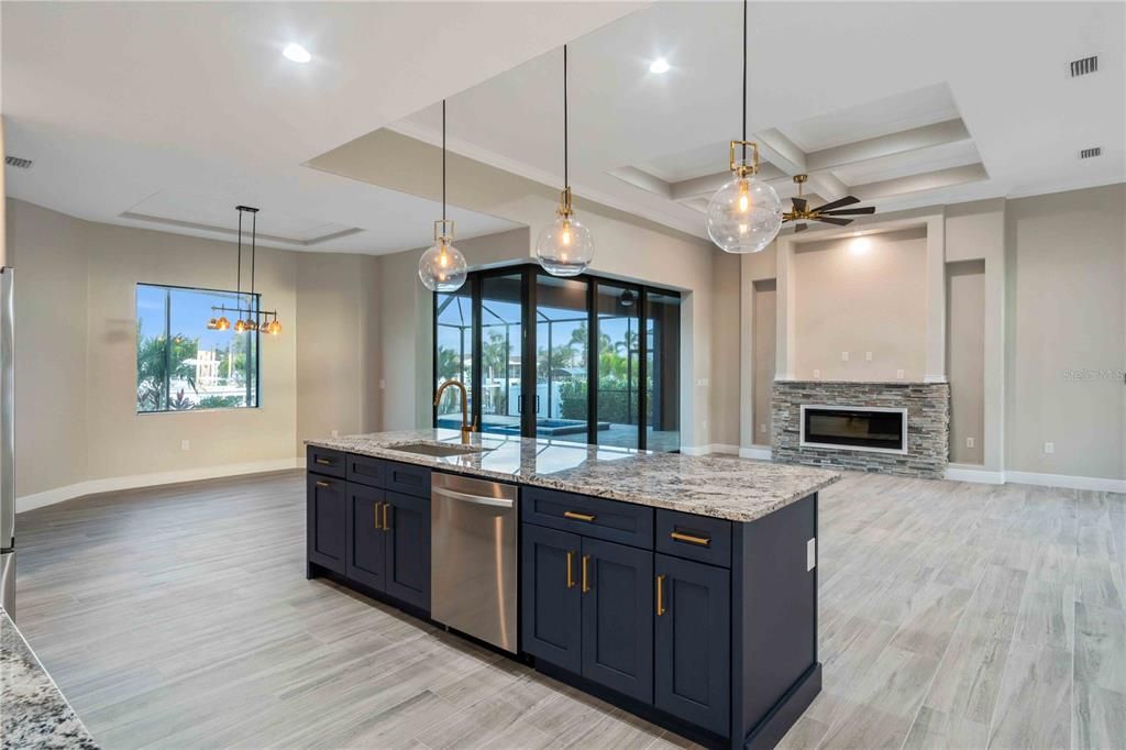Fireplace, Interior, Kitchen, Pendant Lights, Recessed Lighting, Stainless Steel Appliances, Wood Texture Flooring