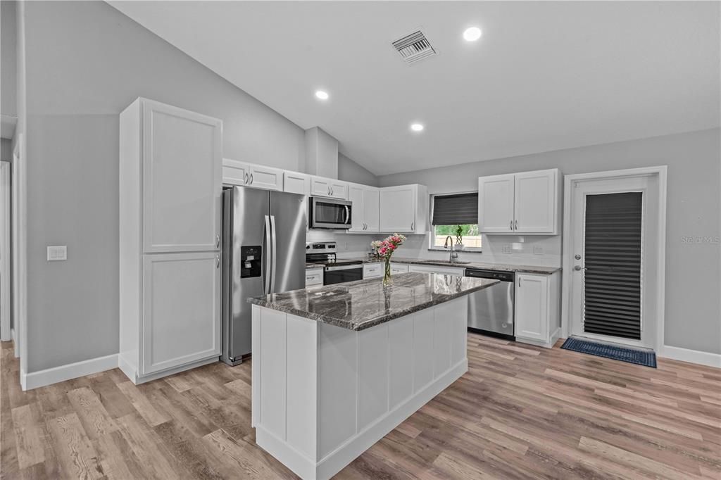 Interior, Kitchen, Recessed Lighting, Stainless Steel Appliances, Wood Texture Flooring