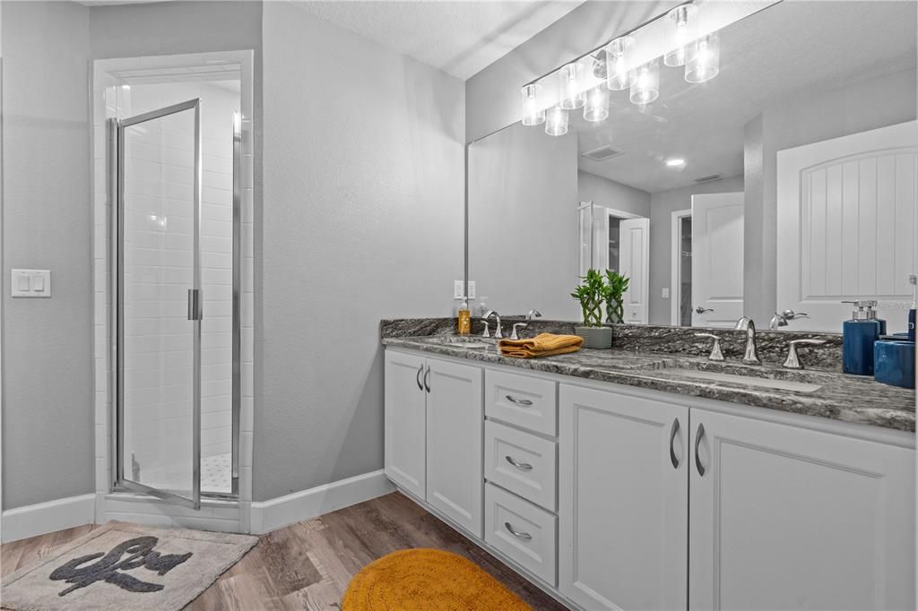 Bathroom, Dual Sink Vanities, Glass Shower, Interior, Recessed Lighting, Wood Texture Flooring