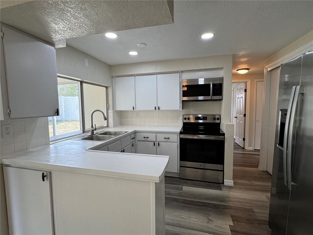 Interior, Kitchen, Recessed Lighting, Stainless Steel Appliances, Wood Texture Flooring