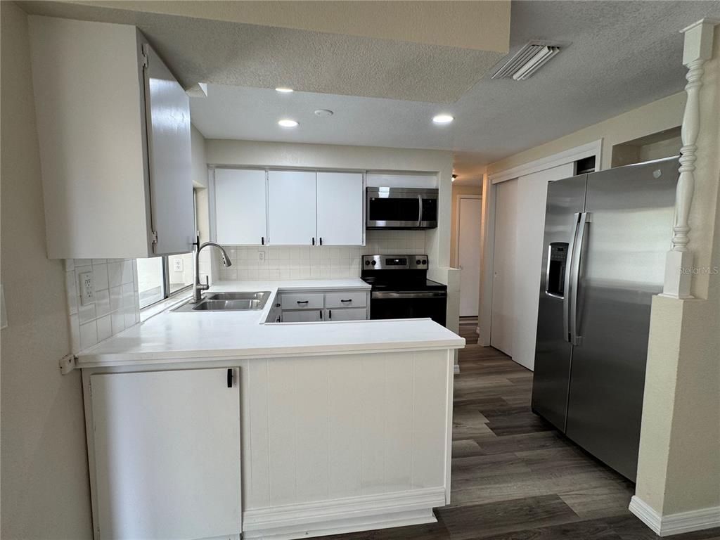 Interior, Kitchen, Recessed Lighting, Stainless Steel Appliances, Wood Texture Flooring