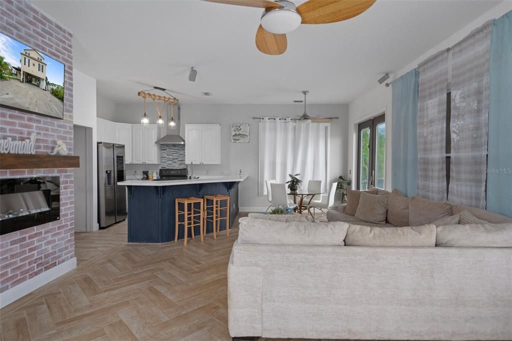 Dining room, Interior, Kitchen, Living room, Pendant Lights, Stainless Steel Appliances, Stone Walls, Wood Texture Flooring