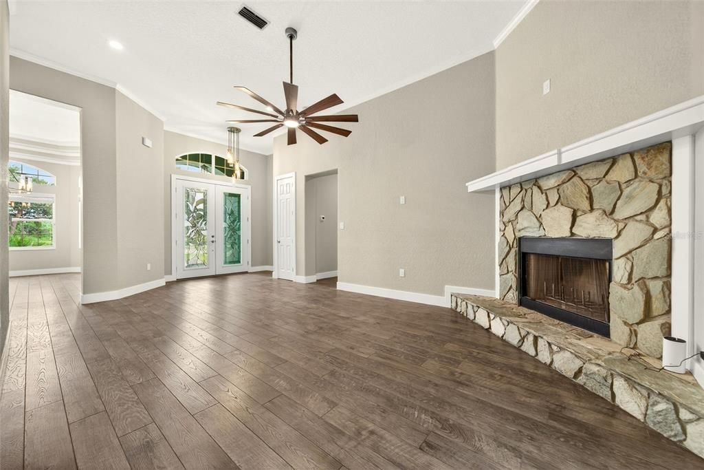Empty room, Fireplace, Interior, Pendant Lights, Recessed Lighting, Wood Texture Flooring