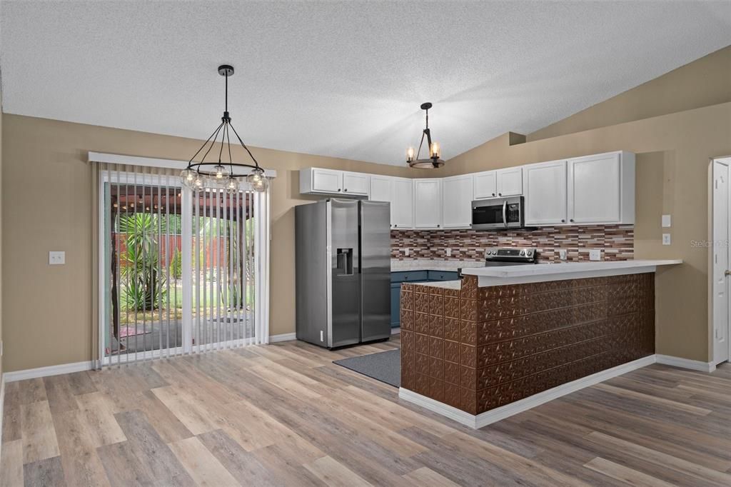 Chandelier, Interior, Kitchen, Pendant Lights, Stainless Steel Appliances, Wood Texture Flooring
