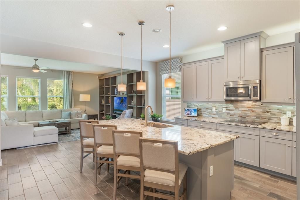 Dining room, Interior, Kitchen, Living room, Pendant Lights, Recessed Lighting, Stainless Steel Appliances, Wood Texture Flooring
