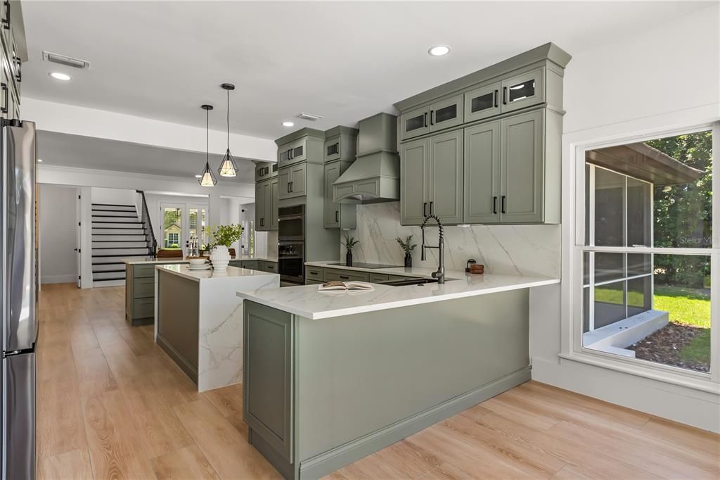 Interior, Kitchen, Marble Walls, Pendant Lights, Recessed Lighting, Stainless Steel Appliances, Wood Texture Flooring