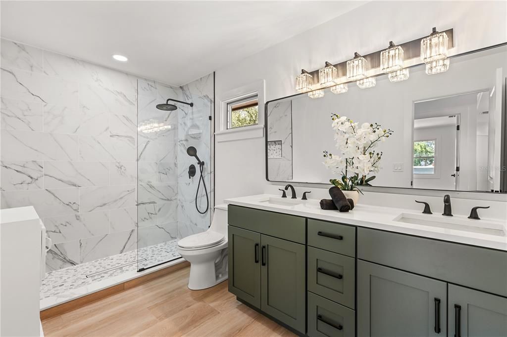 Bathroom, Dual Sink Vanities, Glass Shower, Interior, Marble Walls, Recessed Lighting, Wood Texture Flooring