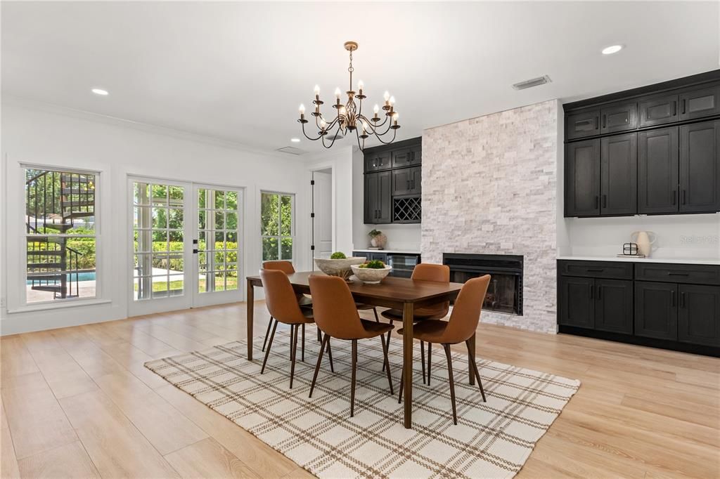 Chandelier, Dining room, Fireplace, Interior, Kitchen, Recessed Lighting, Wood Texture Flooring