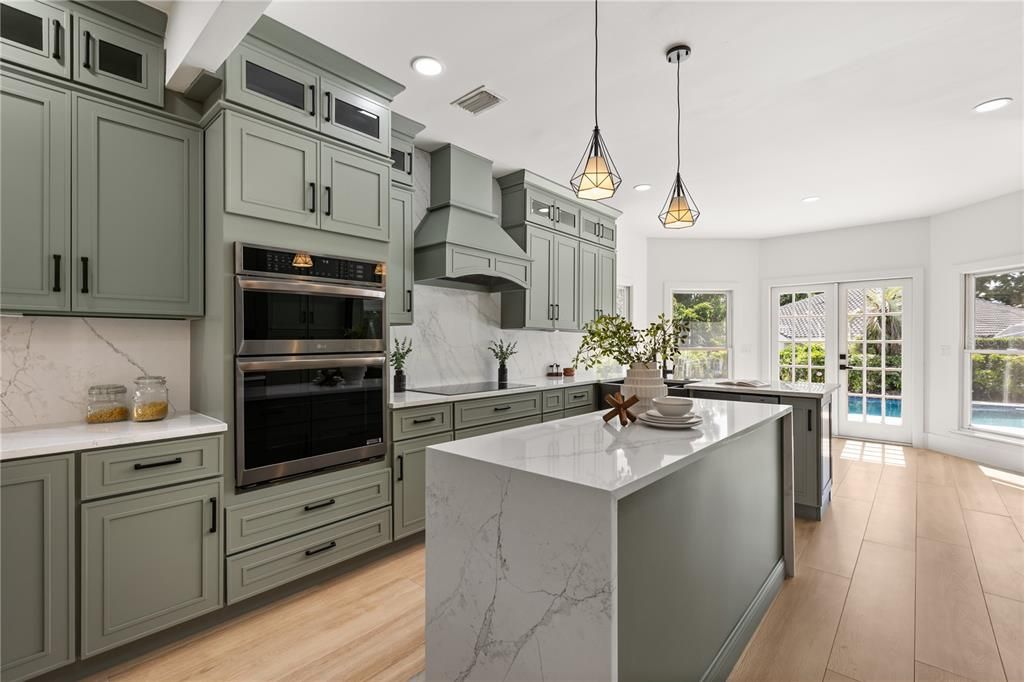 Interior, Kitchen, Marble Walls, Pendant Lights, Recessed Lighting, Stainless Steel Appliances, Wood Texture Flooring