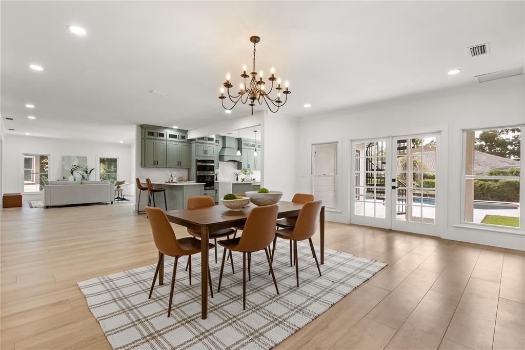 Chandelier, Dining room, Interior, Kitchen, Recessed Lighting, Stainless Steel Appliances, Wood Texture Flooring