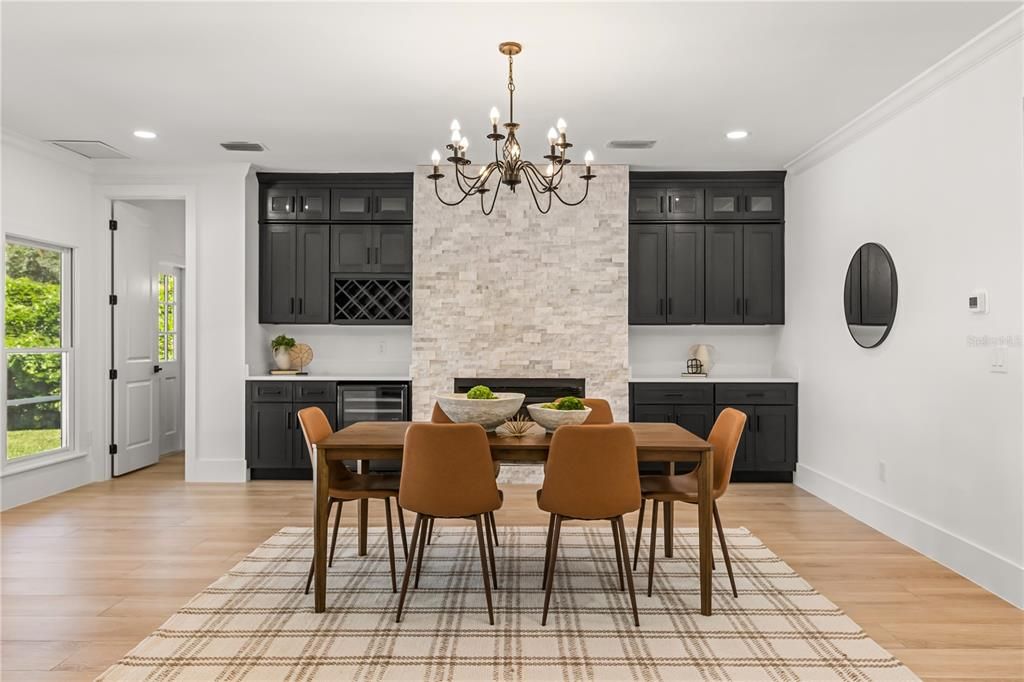 Chandelier, Dining room, Fireplace, Interior, Kitchen, Recessed Lighting, Stone Walls, Wood Texture Flooring
