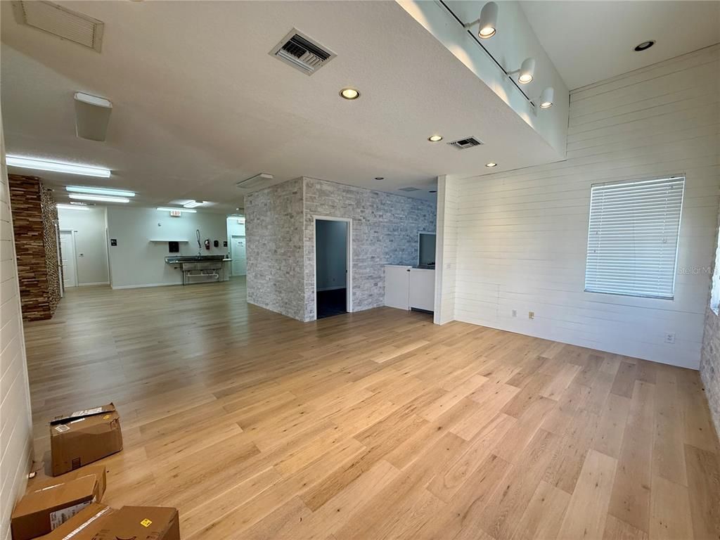 Empty room, Fireplace, Interior, Recessed Lighting, Stone Walls, Wood Texture Flooring