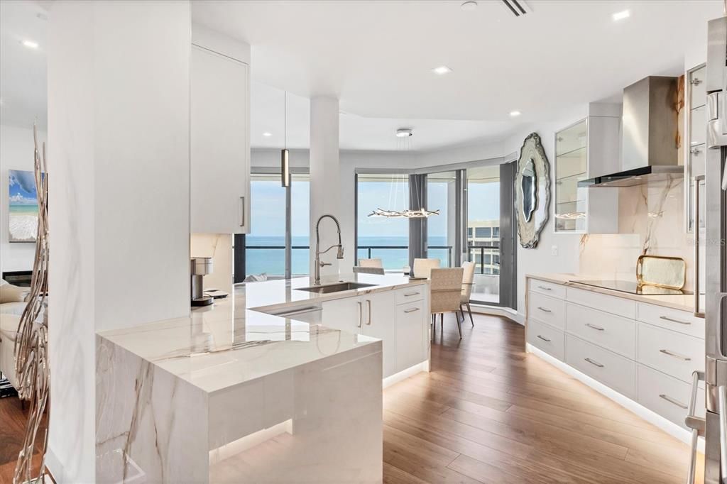 Dining room, Interior, Kitchen, Pendant Lights, Recessed Lighting, Stainless Steel Appliances, Water, Wood Texture Flooring