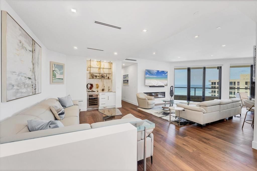 Fireplace, Interior, Living room, Recessed Lighting, Water, Wood Texture Flooring