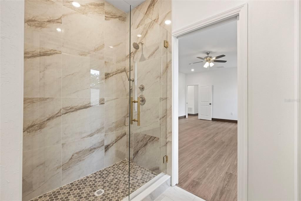 Bathroom, Glass Shower, Interior, Marble Walls, Recessed Lighting, Wood Texture Flooring