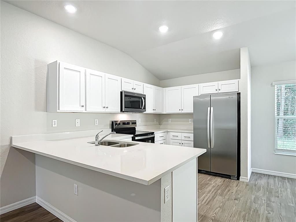 Interior, Kitchen, Recessed Lighting, Stainless Steel Appliances, Wood Texture Flooring