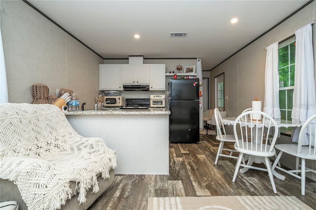Dining room, Interior, Kitchen, Recessed Lighting, Stainless Steel Appliances, Wood Texture Flooring