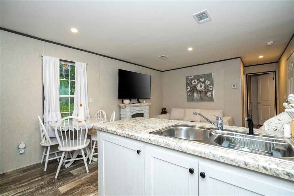 Fireplace, Interior, Kitchen, Recessed Lighting, Wood Texture Flooring