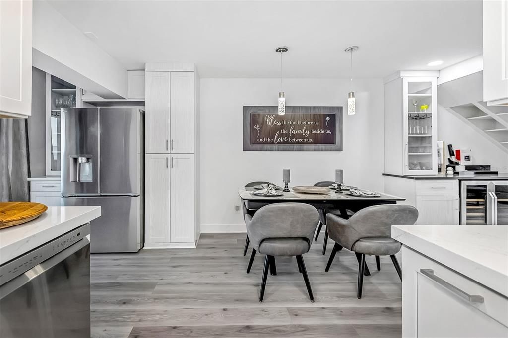 Dining room, Interior, Kitchen, Pendant Lights, Recessed Lighting, Stainless Steel Appliances, Wood Texture Flooring