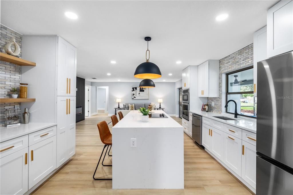 Dining room, Interior, Kitchen, Pendant Lights, Recessed Lighting, Stainless Steel Appliances, Wood Texture Flooring