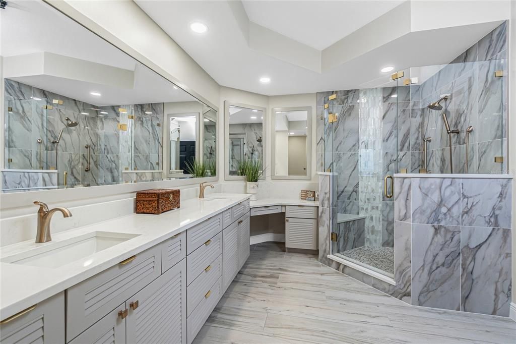 Bathroom, Dual Sink Vanities, Glass Shower, Interior, Marble Walls, Recessed Lighting, Wood Texture Flooring