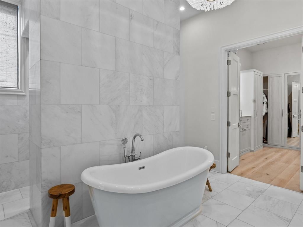 Bathroom, Free Standing Baths, Interior, Marble, Marble Walls, Recessed Lighting, Wood Texture Flooring