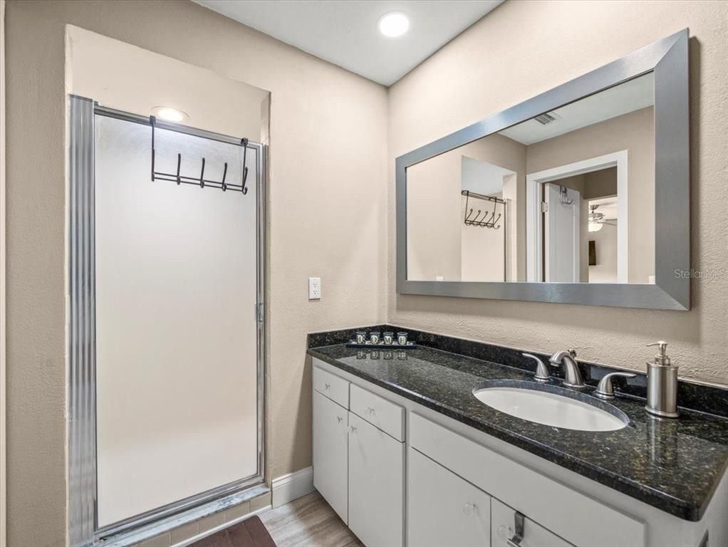 Bathroom, Dual Sink Vanities, Interior, Recessed Lighting, Wood Texture Flooring