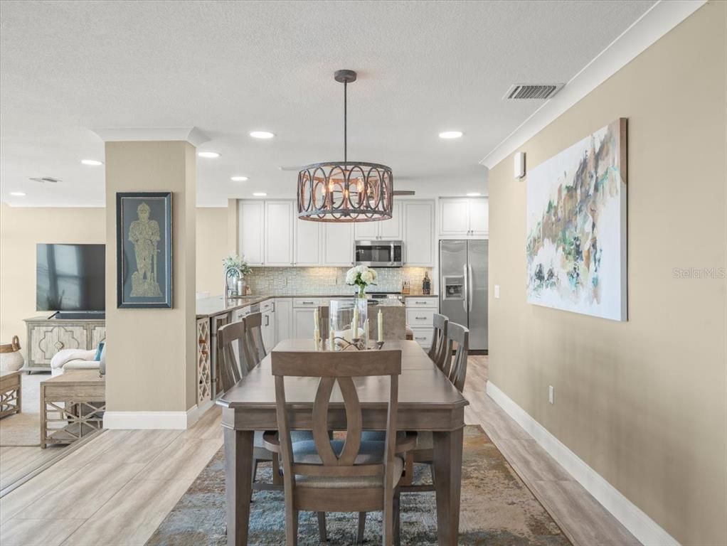 Dining room, Interior, Kitchen, Pendant Lights, Recessed Lighting, Stainless Steel Appliances, Wood Texture Flooring