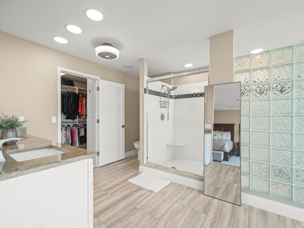 Bathroom, Bedroom, Glass Shower, Interior, Recessed Lighting, Walk-in Closets, Wood Texture Flooring