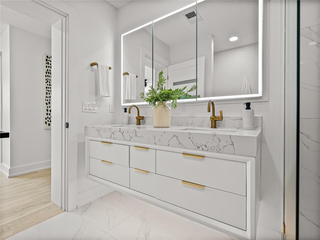 Bathroom, Dual Sink Vanities, Interior, Marble, Marble Walls, Recessed Lighting, Wood Texture Flooring