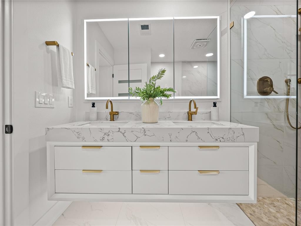 Bathroom, Dual Sink Vanities, Glass Shower, Interior, Marble, Marble Walls, Recessed Lighting