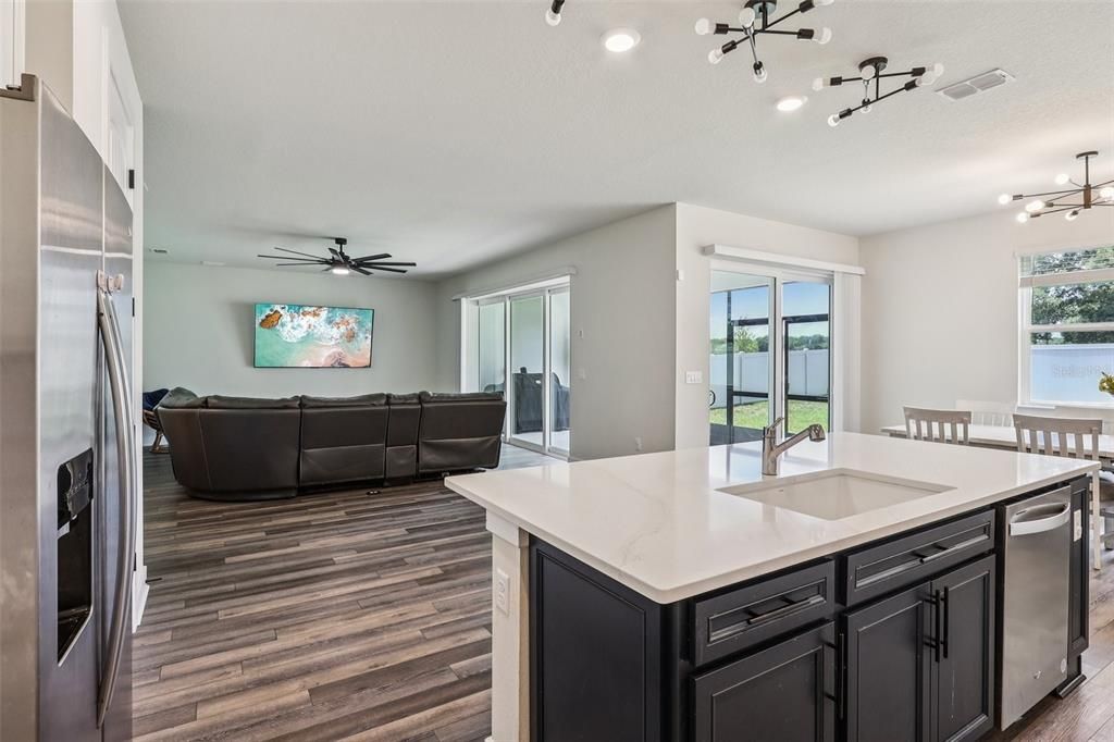 Dining room, Interior, Kitchen, Living room, Pendant Lights, Recessed Lighting, Stainless Steel Appliances, Water, Wood Texture Flooring