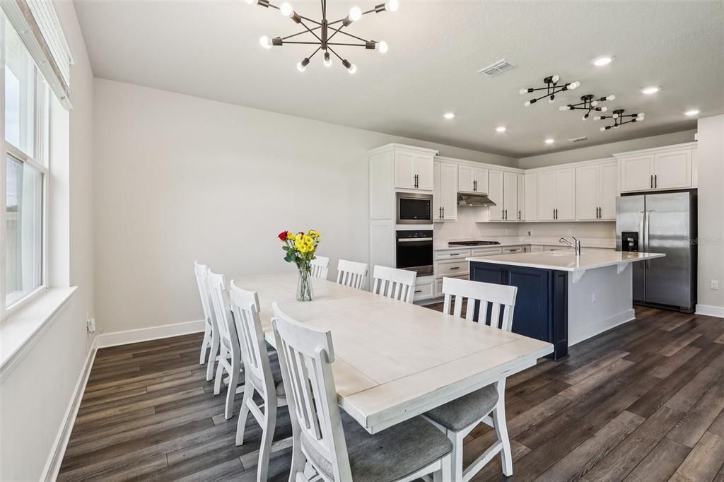 Dining room, Interior, Kitchen, Pendant Lights, Recessed Lighting, Stainless Steel Appliances, Wood Texture Flooring