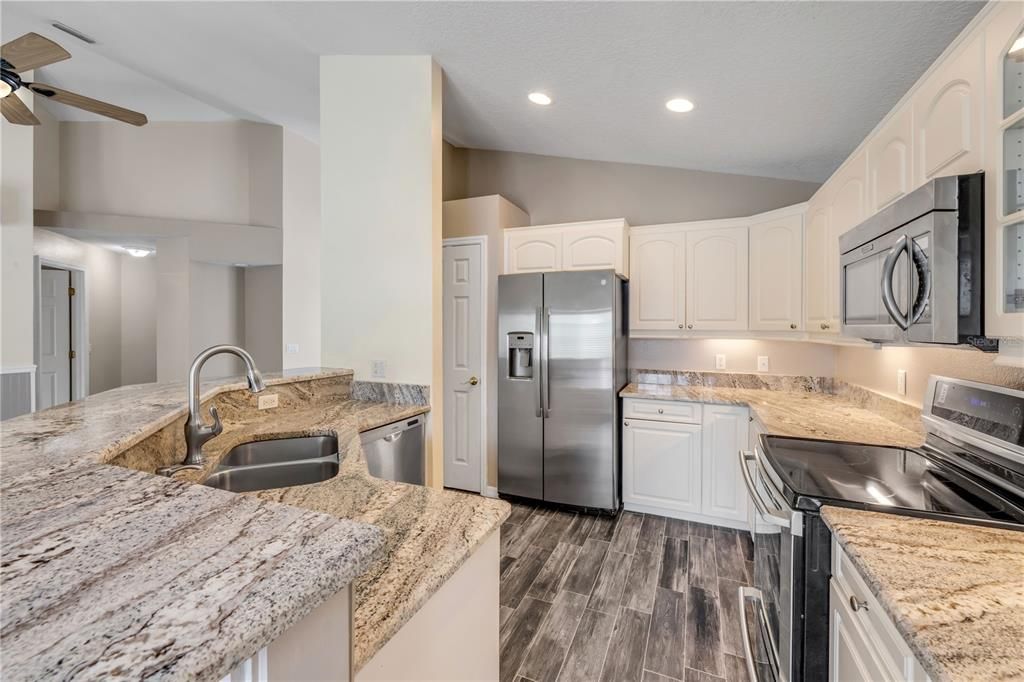 Interior, Kitchen, Recessed Lighting, Stainless Steel Appliances, Wood Texture Flooring