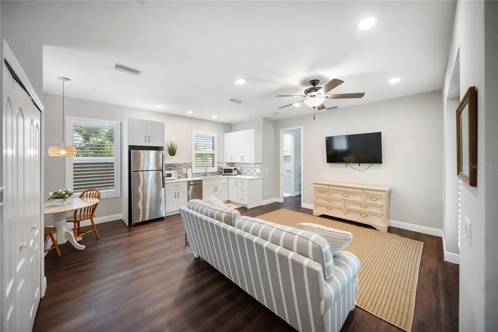 Dining room, Interior, Kitchen, Pendant Lights, Recessed Lighting, Stainless Steel Appliances, Wood Texture Flooring