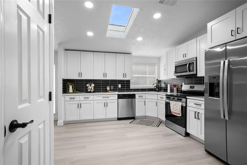 Interior, Kitchen, Recessed Lighting, Stainless Steel Appliances, Wood Texture Flooring