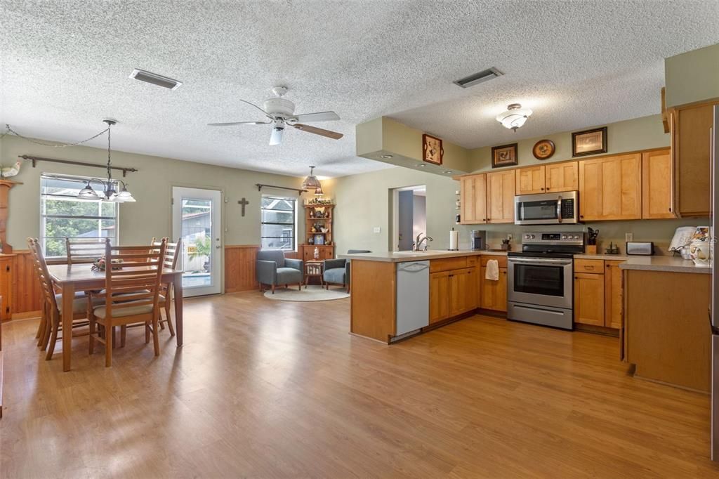 Dining room, Interior, Kitchen, Pendant Lights, Stainless Steel Appliances, Wood Texture Flooring