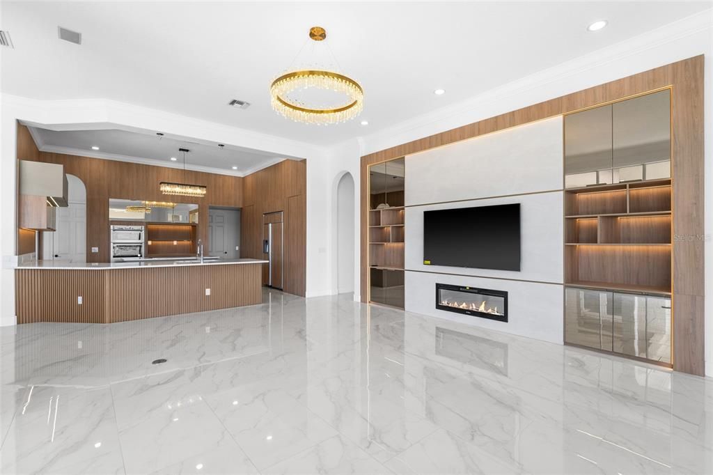 Chandelier, Fireplace, Interior, Kitchen, Marble, Pendant Lights, Recessed Lighting, Stainless Steel Appliances