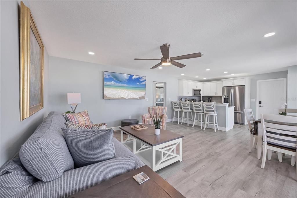 Dining room, Interior, Kitchen, Living room, Recessed Lighting, Stainless Steel Appliances, Wood Texture Flooring