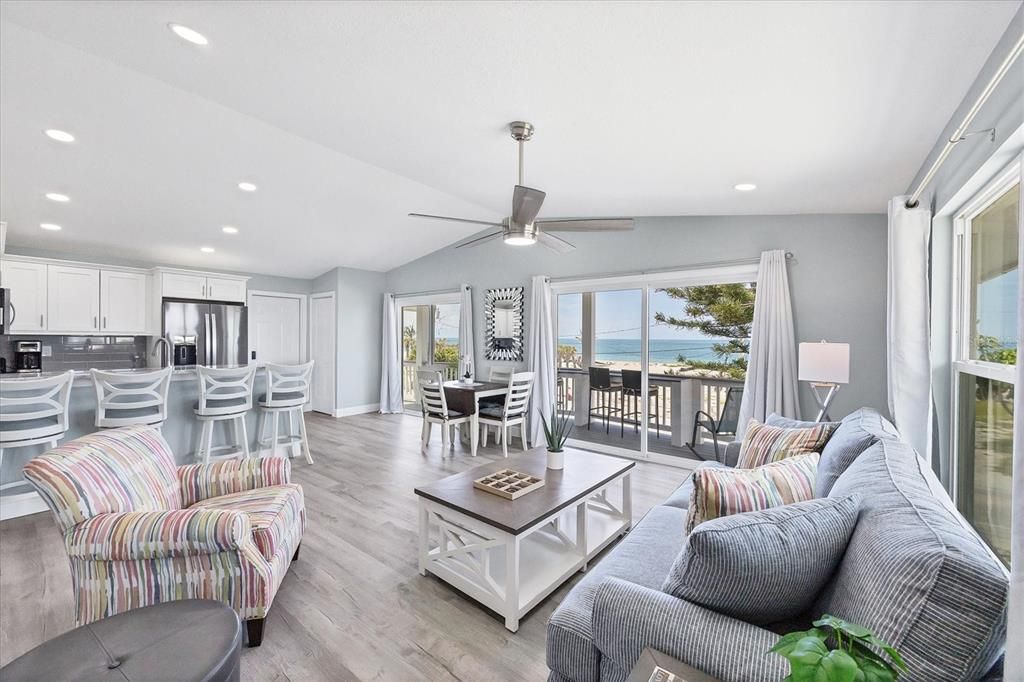 Dining room, Interior, Kitchen, Living room, Recessed Lighting, Stainless Steel Appliances, Water, Wood Texture Flooring