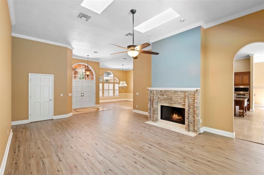 Chandelier, Empty room, Fireplace, Interior, Pendant Lights, Recessed Lighting, Wood Texture Flooring