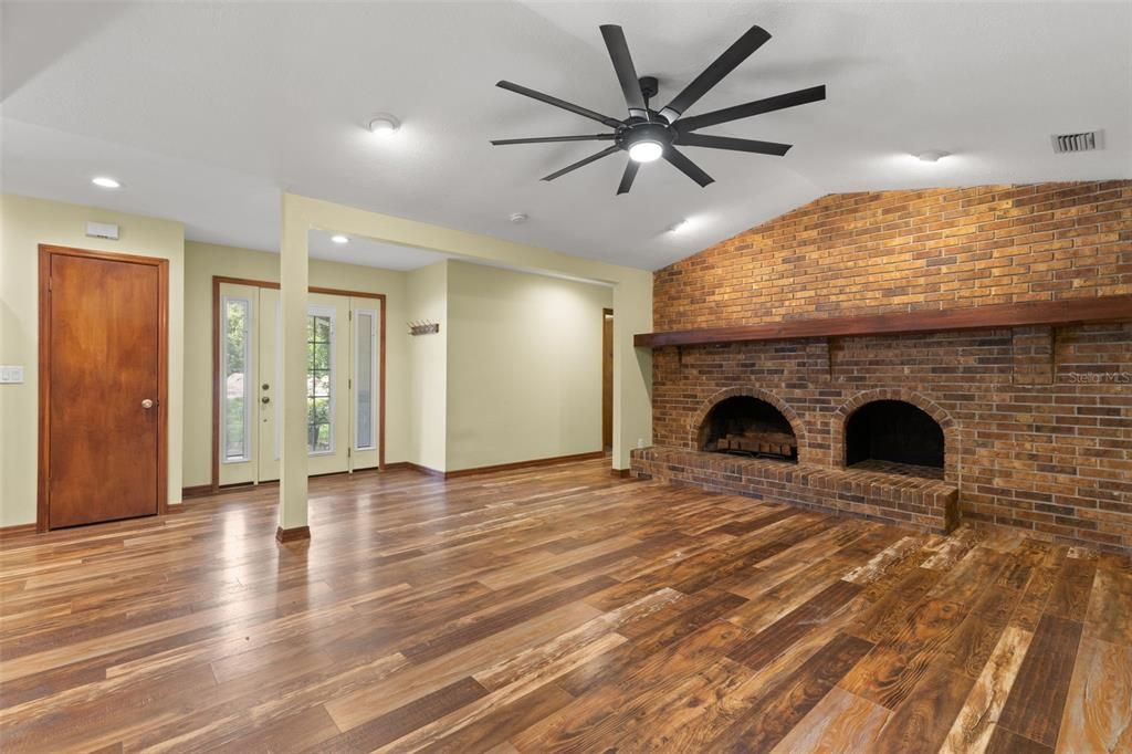 Empty room, Fireplace, Interior, Recessed Lighting, Stone Walls, Wood Texture Flooring